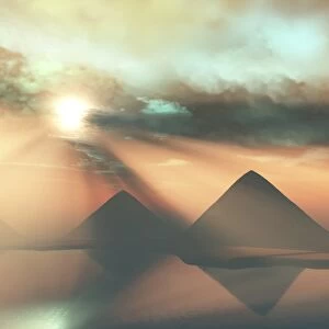 Sunrays shine down on three pyramids along the Nile River on the Giza Plateau
