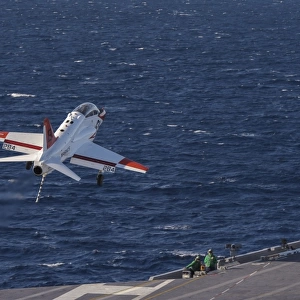 A U. S. Navy T-45C Goshawk performs a touch-and-go landing