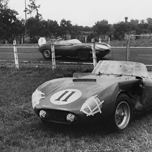 1955 Le Mans, Hawthorns Jaguar D type passes de Portagos stricken Ferrari. Creator: Unknown