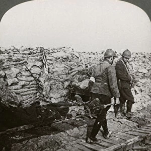 Belgian stretcher bearers carrying wounded in a trench, Dixmude, Belgium, World War I, 1914-1918. Artist: Realistic Travels Publishers