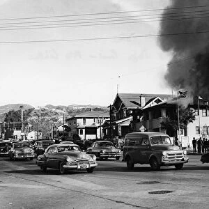 Fire in building causing traffic to slow, Glendale, Burbank, California 1951. Creator: Unknown