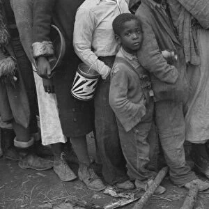 Flood refugees at mealtime, Forrest City, Arkansas, 1937. Creator: Walker Evans