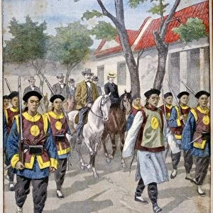 A foreigner under the guard of regular Chinese army, China, 1900. Artist: Oswaldo Tofani