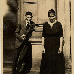 Franz Kafka with his sister Ottla before Oppelt House in Prague Artist: Anonymous