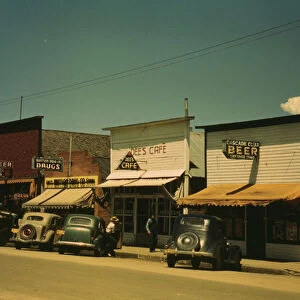 On main street of Cascade, Idaho... 1941. Creator: Russell Lee
