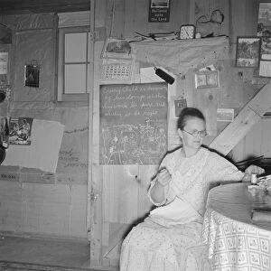 Mrs. Hull in one-room dugout basement home, Dead Ox Flat, Malheur County, Oregon, 1939. Creator: Dorothea Lange