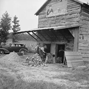 Putting in new flues in tobacco barn, Orange County, North Carolina, 1939. Creator: Dorothea Lange