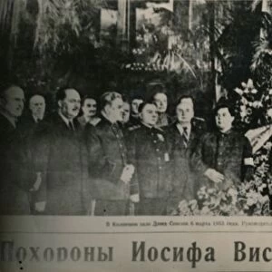 Soviet leaders visit the flower-decked bier of Stalin in Moscows Hall of Columns. Behind the chief
