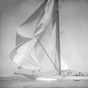 Spinnaker flying on unknown yacht. Creator: Kirk & Sons of Cowes