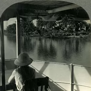 On a Steamer on the Lualaba River, Belgian Congo - A Native Village at the Waters Edge, c1930s