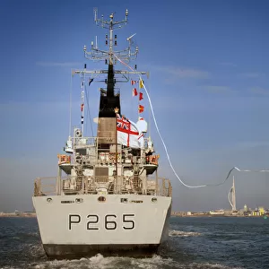 HMS Dumbarton Castle displays her Paying Off Pennant as she enters Portsmouth Harbour