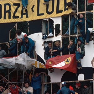 1976 Italian Grand Prix: The Tifosi take to whatever means possible to get a decent view of the Ferrari cars, atmosphere