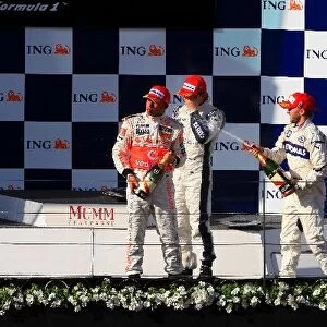 Aust F1 GP Albert Park: The podium: Lewis Hamilton McLaren, race winner; Nick Heidfeld BMW Sauber F1, second; Nico Rosberg Williams, third