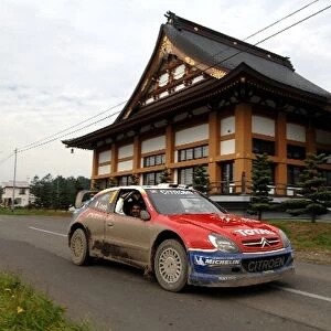 FIA World Rally Championship: Sebastien Loeb, Citroen Xsara WRC, passes a temple