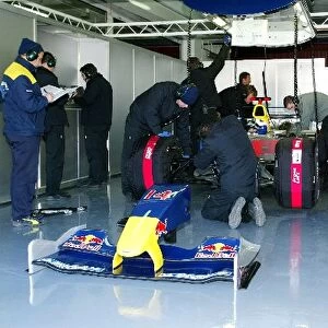 Formula One Testing: Engineers work on the car of David Coulthard Red Bull Racing RB01