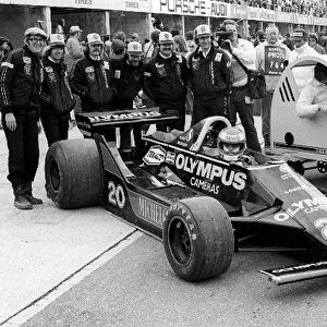 Formula One World Championship: Keke Rosberg Wolf WR7, who crashed out of the race on lap 21, sits in on an impromptu team photograph with a