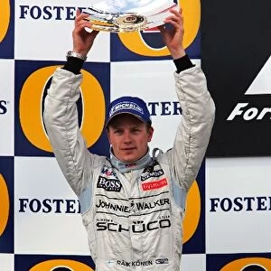 Formula One World Championship: Kimi Raikkonen McLaren celebrates on the podium