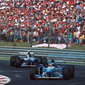 Formula One World Championship: Michael Schumacher leads Damon Hill before they eventually collided on lap 23
