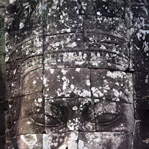 A face sculpture on a stone wall at angkor wat; Cambodia