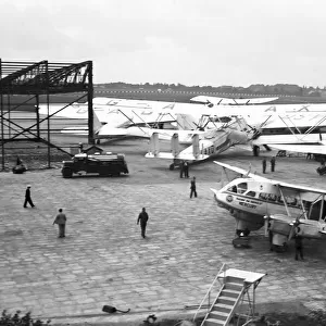 in the foreground DE HAVILLAND DH. 86 EXPRESS, G-ACVY / 2302, RAILWAY AIR SERVICES at Castle Bromwich Aerodrome
