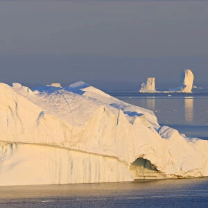 Icebergs at Ilulissat icefjord at sunrise, Ilulissat, Icefjord, Disko Bay, Qsuitsup, Greenland, Polar Regions, Arctic