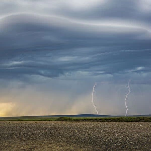 Lightning Bolts Descend From Dark Clouds Over The Tundra Of Alaskas Northwest Arctic And The Kokolik River, Kokolik National Petroleum Reserve, Arctic Alaska, Usa