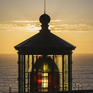 The Sun Sets At Cape Meares Lighthouse; Oregon, United States Of America