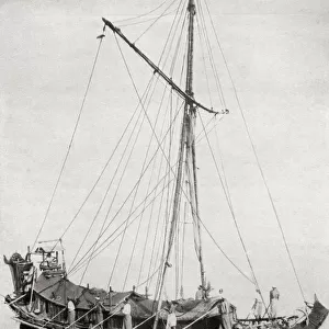 Traditional craft on the Irrawaddy River, Myanmar. Progress is made by poling, a crew being divided along each side of the ship, while the helmsman sits high above the stern. From The Book of Ships, published c. 1920
