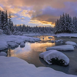 Winter scene of the Mendenhall River in the Tongass Forest at sunset, Juneau, Alaska, USA