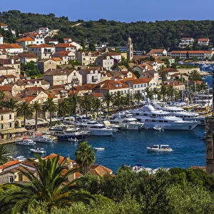 Yachts in the marina at the Old Town of Hvar with St Marks Church bell tower (right) on Hvar Island, Croatia