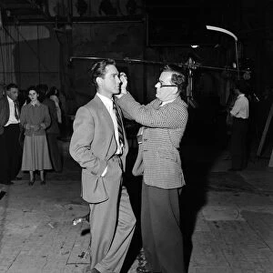 Actor Richard Todd being made up at Pinewood Studios. 1st June 1952