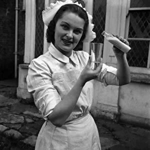 Actress his a Daniely seen here dressed as a nurse on the set of the film "