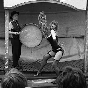 Actress Helen Mirren wearing a fishnet tights portraying character of fairground stripper
