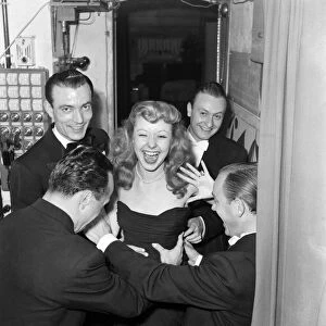 Actress Maria Riqueline tickled off-stage after a performance. October 1952 C4907