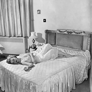 Actress Zena Marshall asleep. December 1953 D7606