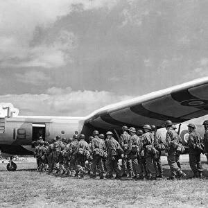 Airborne soldiers board a Airspeed Horsa gliders in preparation for moving off to their