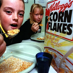 Alan Jackson, 10, and Jenene Brodie, 9, tuck into their breakfast at Laurel Avenue