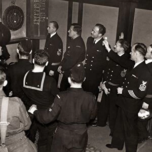 American sailors challenge ARP personel to a game of dartsat the Cranley Arms Chelsea