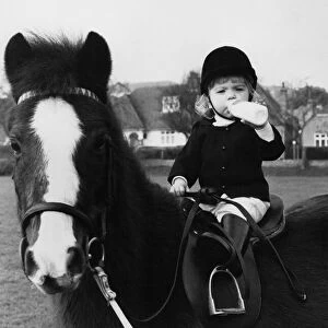 Animals - Children with Horses. Little Charlotte takes a "stirrup cup"