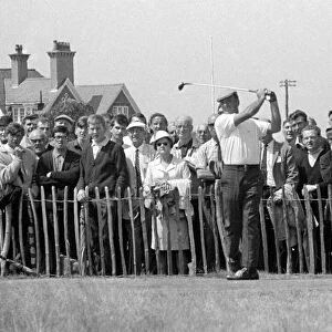 Argentine golfer Roberto de Vicenzo adriving off watched by spectators during the British