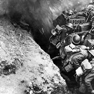British troops cower as a shell bursts on the parapet of their trench "