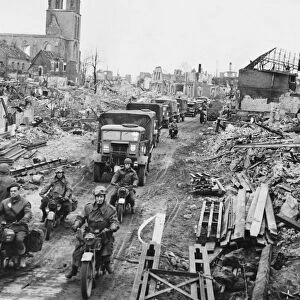 British troops and transport moving through the cleared streets of Stadtlohn, Germany