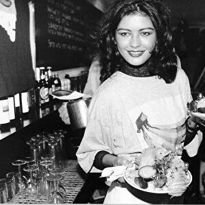 Catherine Zeta Jones Actress plays a waitress at the Cafe Casbar in aid of a charity