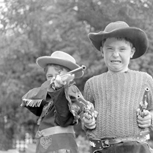 Children dressed & playing Cowboys 29th August 1956. Local Caption Cowboys