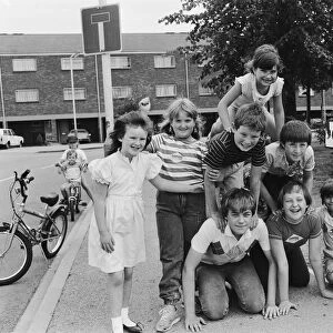 Children of Olympic Way in London, playing a game on the streets outside their homes