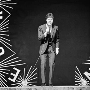 Cliff Richard singing on stage during the Eurovision Song Contest rehearsals at Albert
