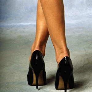 Clothing Boots And Shoes. A model presents black high heel shoes