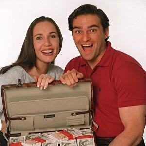 Couple with Suitcase of Money - Daily Mirror Promotion