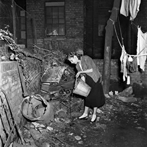 Crowded home. Slums in Paddington - condemned house with no lavatory