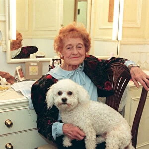 Emily Perry sitting in her dressing room with her dog, West End production of Dame Edna